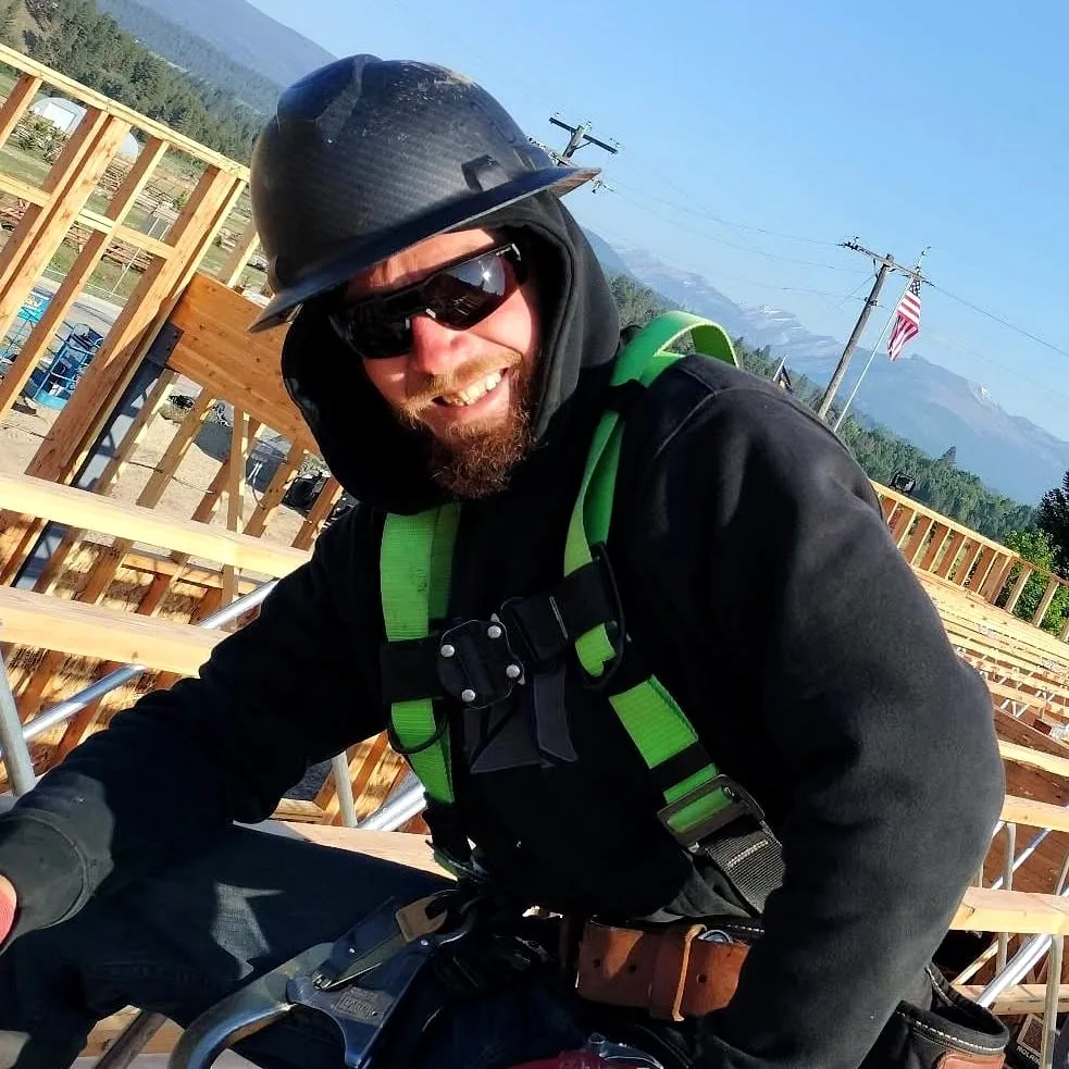 Brady Chismar working on a framed structure