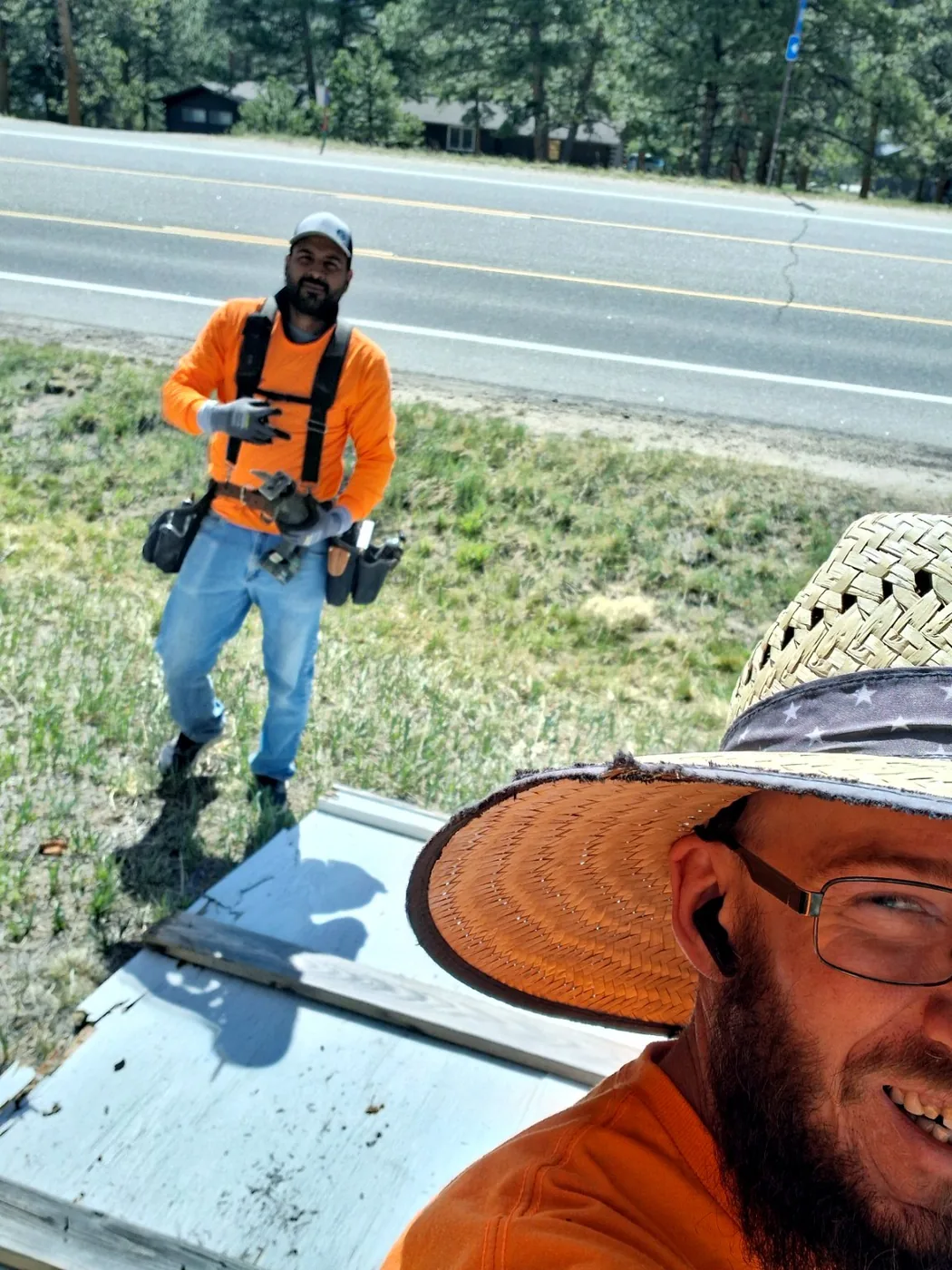 Brady Chismar and Julio working together in the field