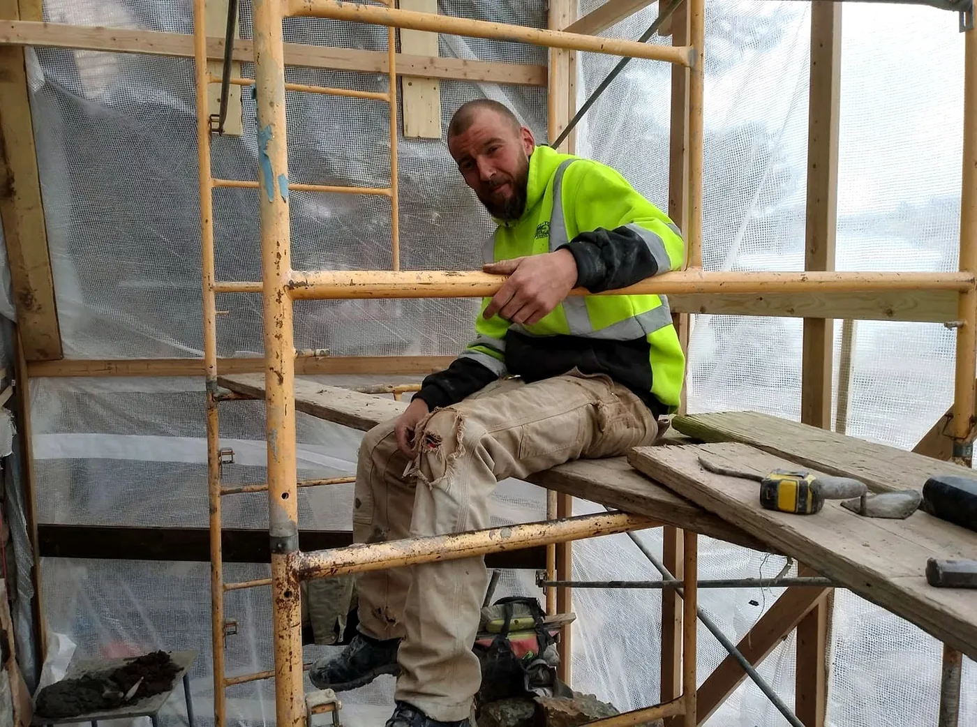 Brady Chismar working from scaffold during a construction project