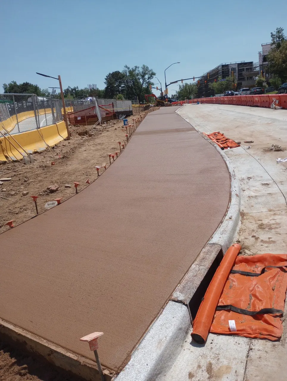 Freshly finished commercial concrete sidewalk