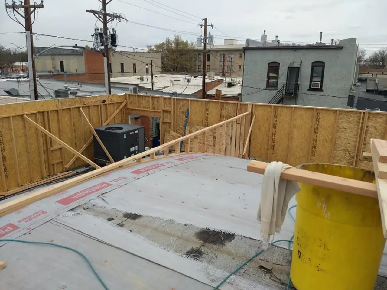 Commercial wall framing above an existing structure