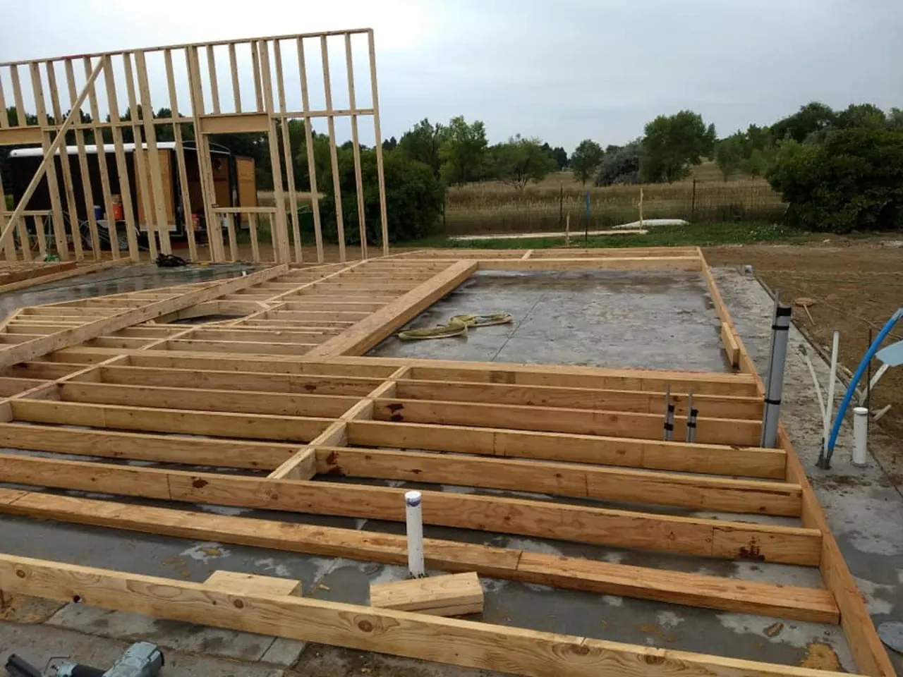 Floor joist system framed over a slab