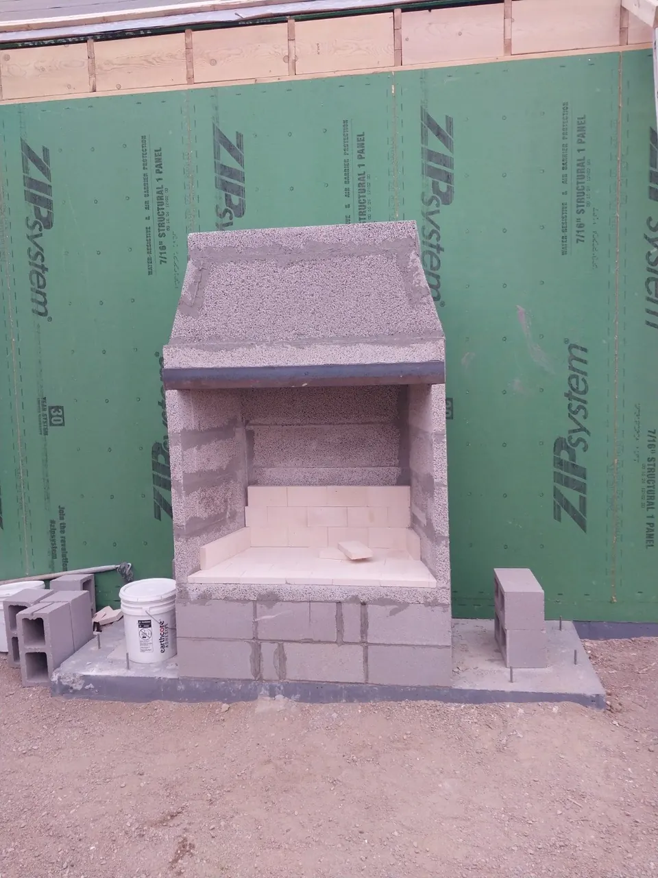 Outdoor masonry fireplace under construction