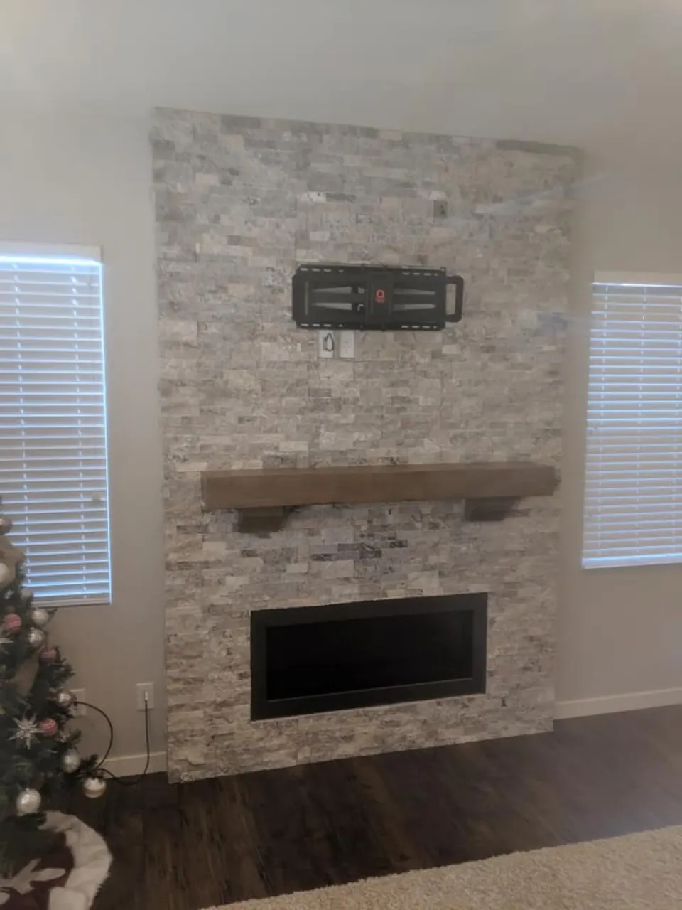 Finished stone fireplace from Brady's construction career