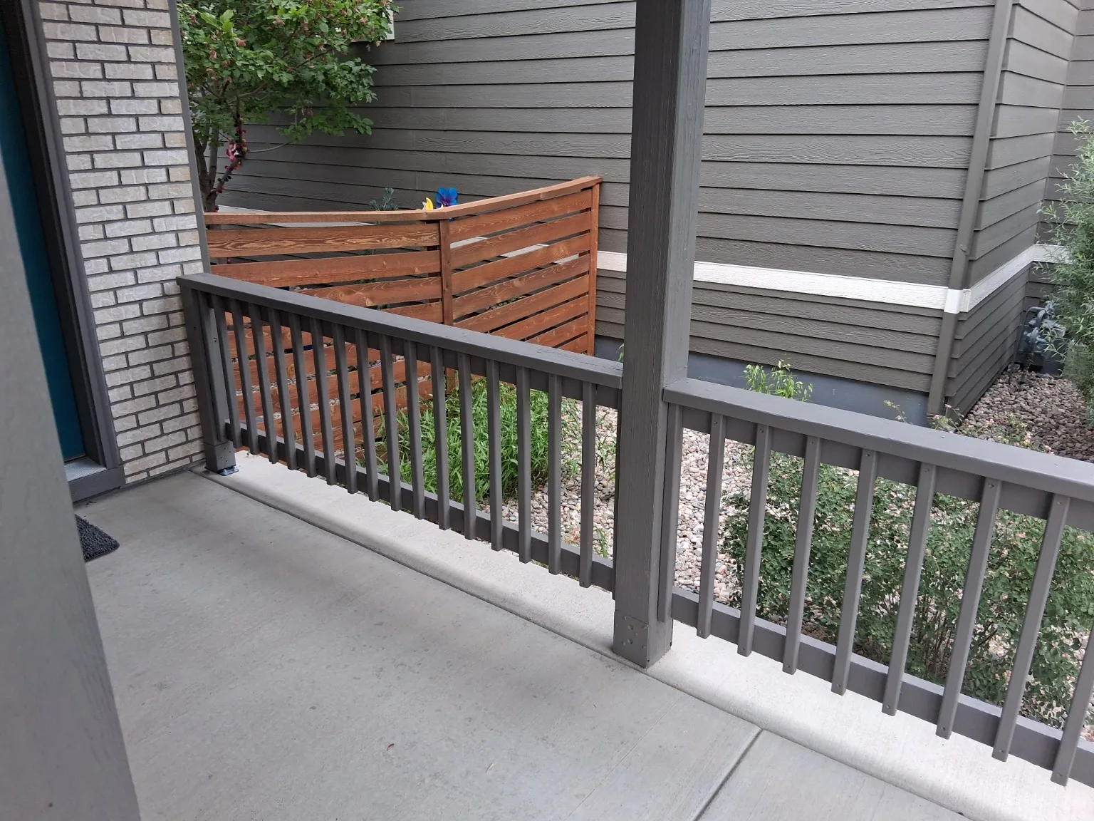 Close view of porch railing posts and balusters