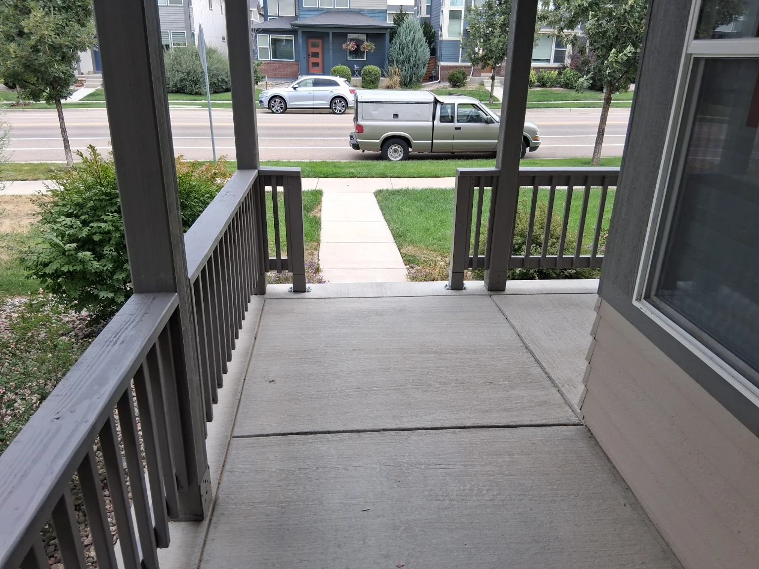 Covered porch railing viewed from the entry