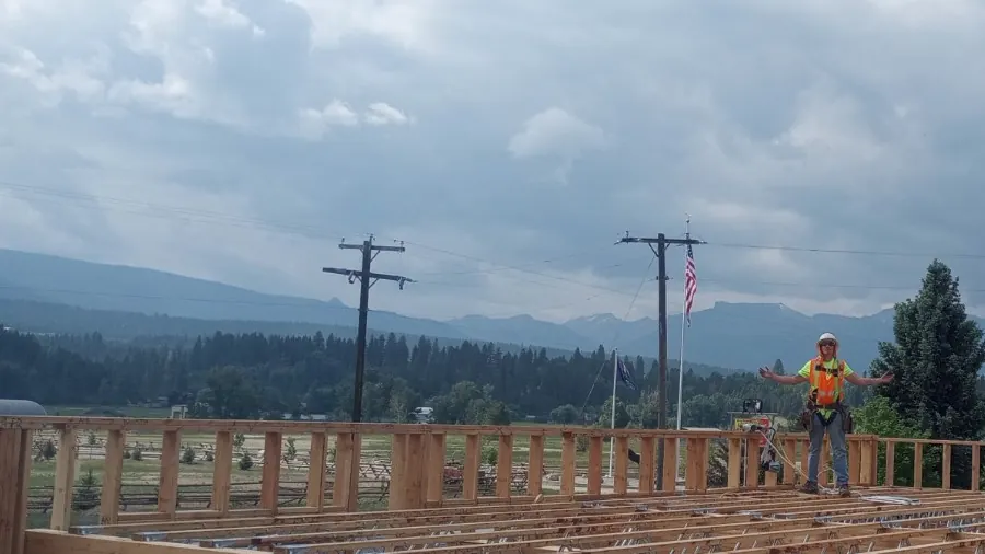 Brady working on a framed structure in the Colorado mountains