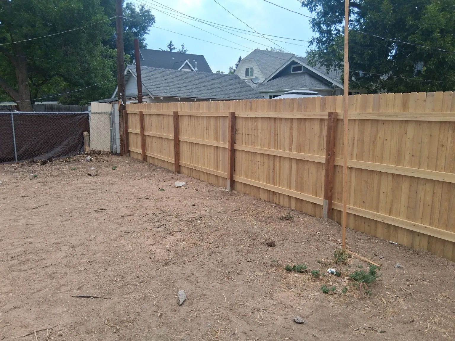 Rail side of a recent cedar privacy fence installation